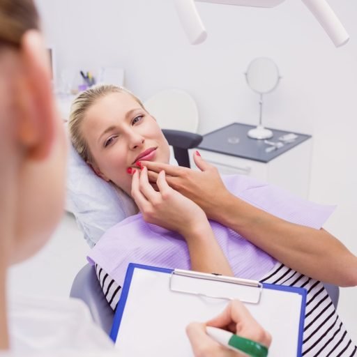 female-patient-with-toothache-clinic-min female-patient-with-toothache-clinic-min